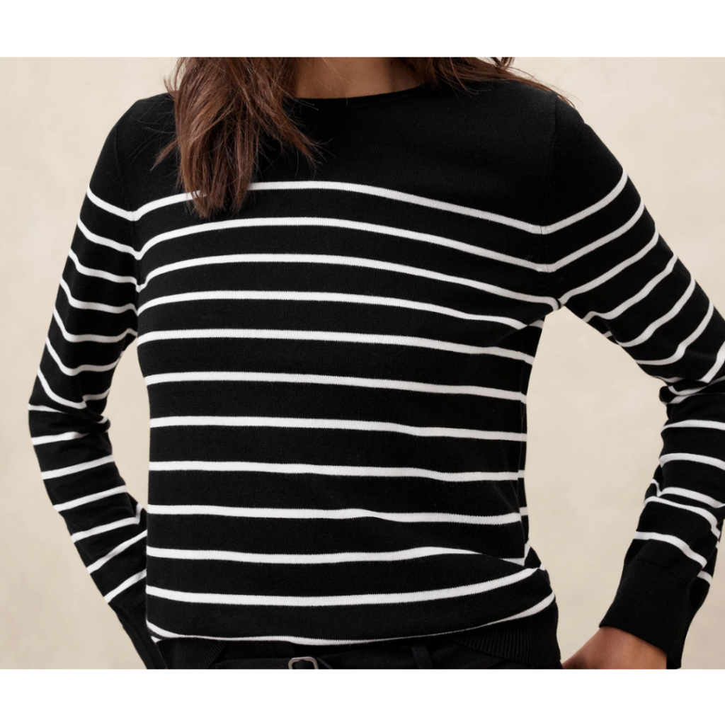 Picture of woman in black sweater with white stripes. Link included for purchase.