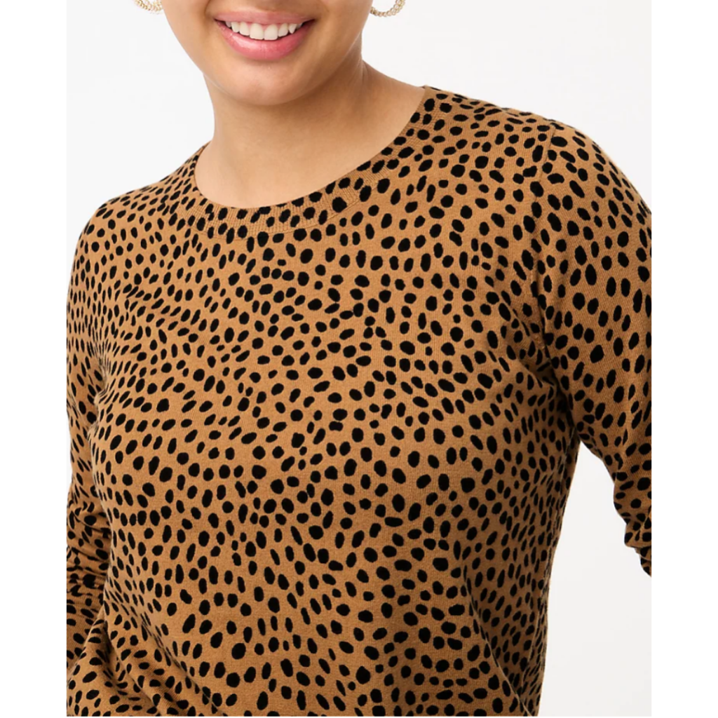 Woman in cheetah print sweater. Link included for purchase.