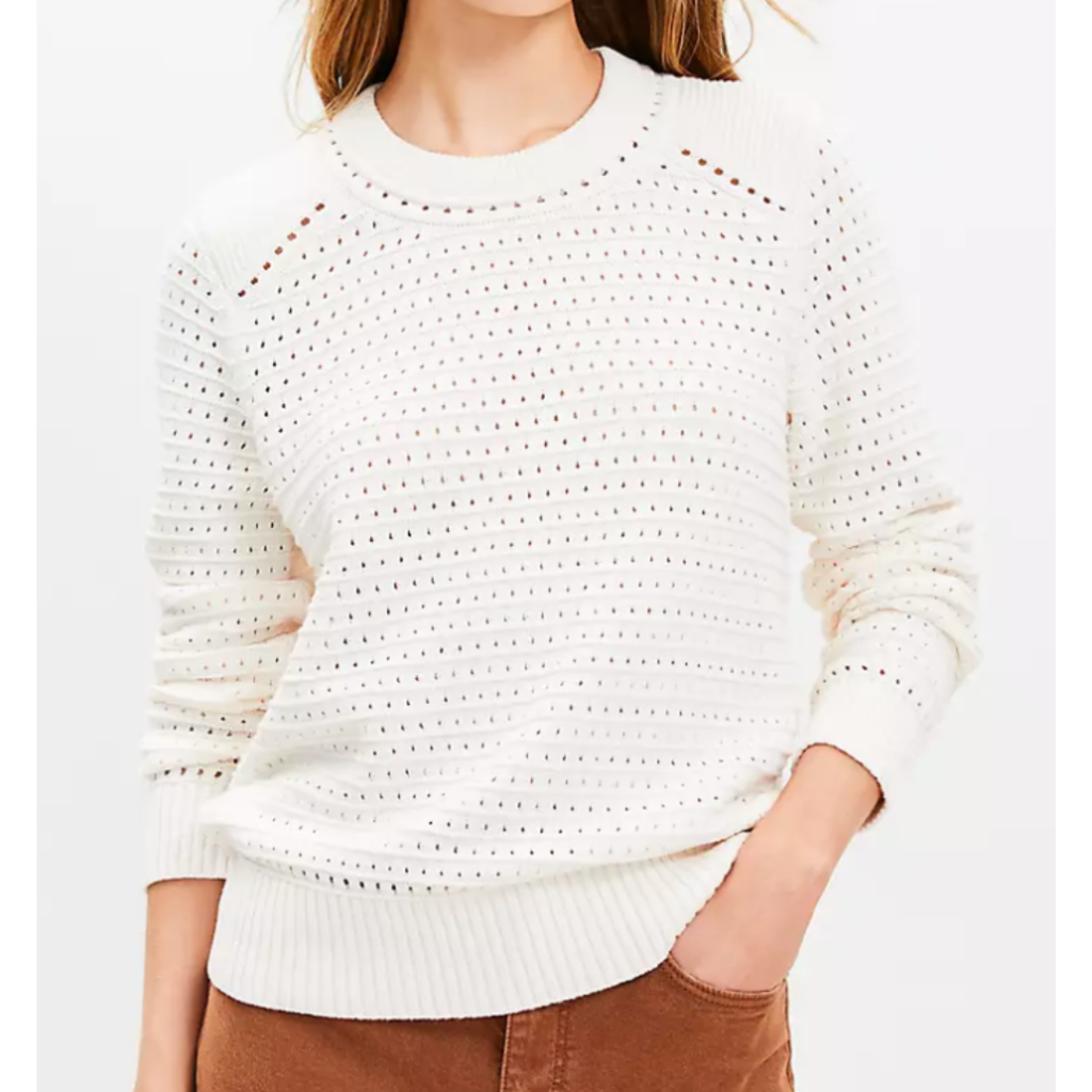 Woman wearing white pointelle sweater. Link included to purchase.