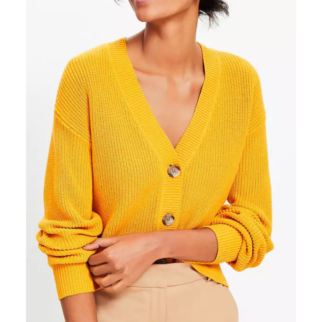 Woman wearing yellow V-neck button up cardigan. Link included to purchase. Link included for purchase.