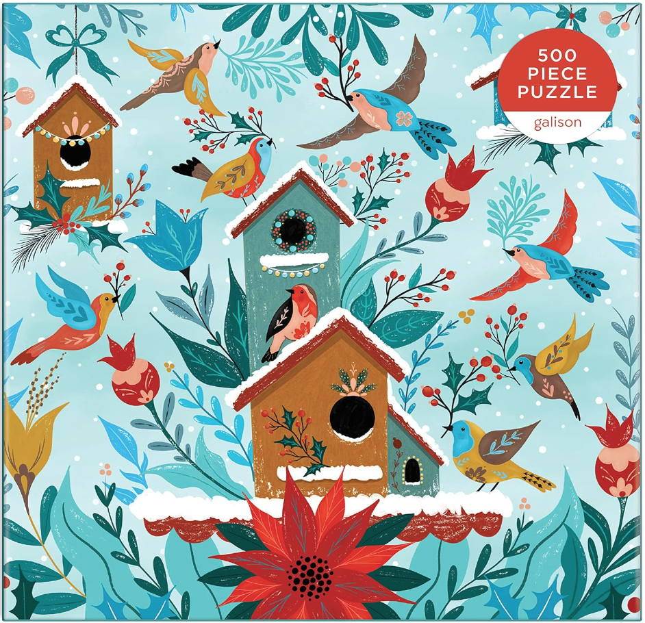 Image of  winter puzzle that has different colored birds flying around bird houses with holly and winter foliage. Puzzle has blue background. 