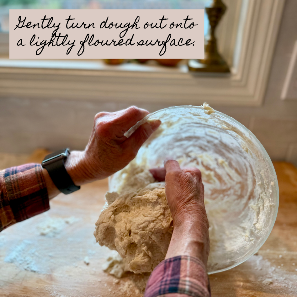 Image of woman turning dough on lightly floured wooden cutting board. Text says "gently turn dough out onto a lightly floured surface."