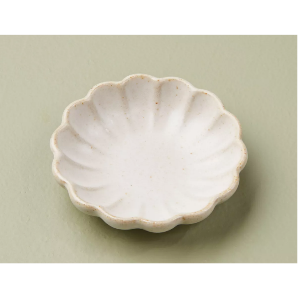 Image of white ceramic fluted jewelry dish with sage green background. Link provided below for purchase.