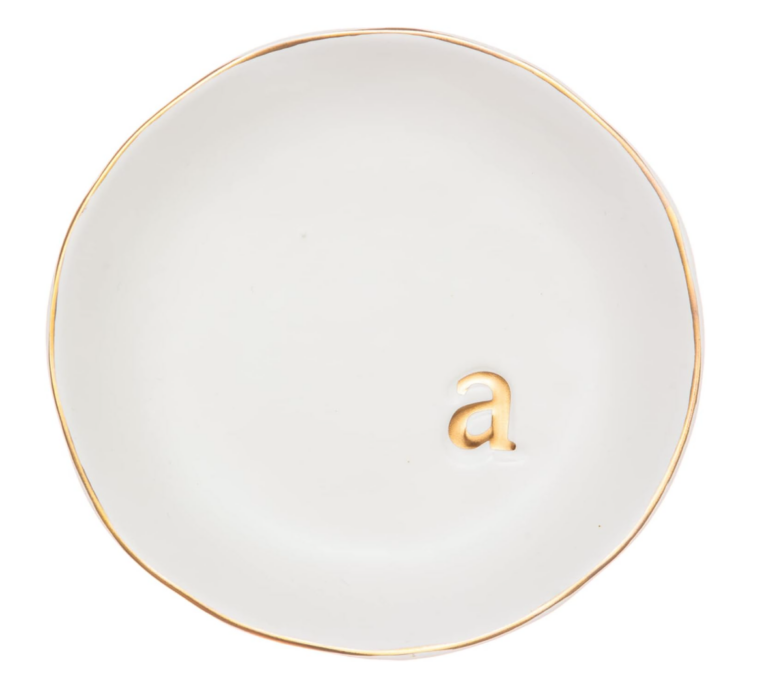 White ceramic circular tray with letter A in gold and gold boarder.