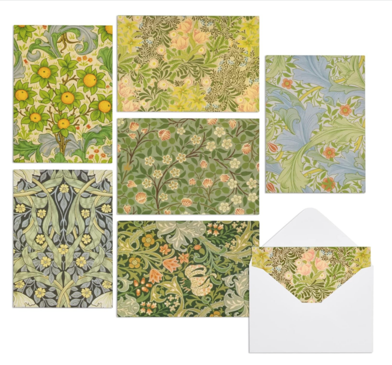 Image of William Morris stationary set. Set is floral with shades of green. yellow, peach, green, and blue.