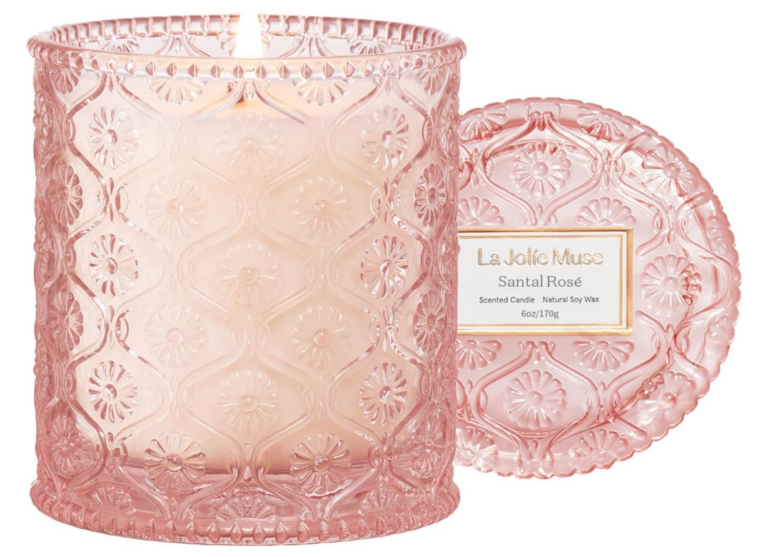 Image of candle in pink glass container. 