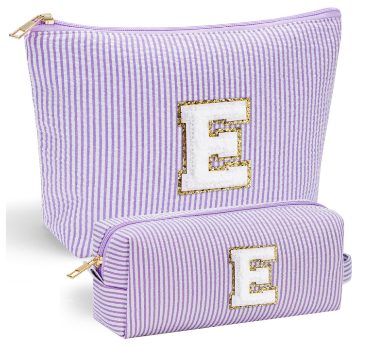 Image of two travel bags in purple and white stripe and initial "E". 