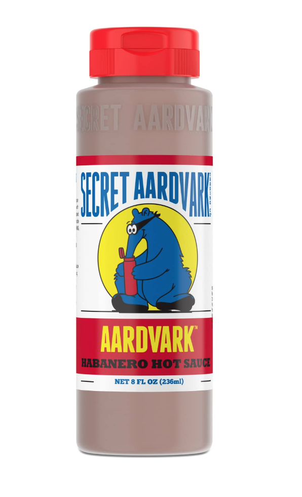 Basic household essentials. Image of Secret Aardvark habanero hot sauce. Label has a blue aardvark. 