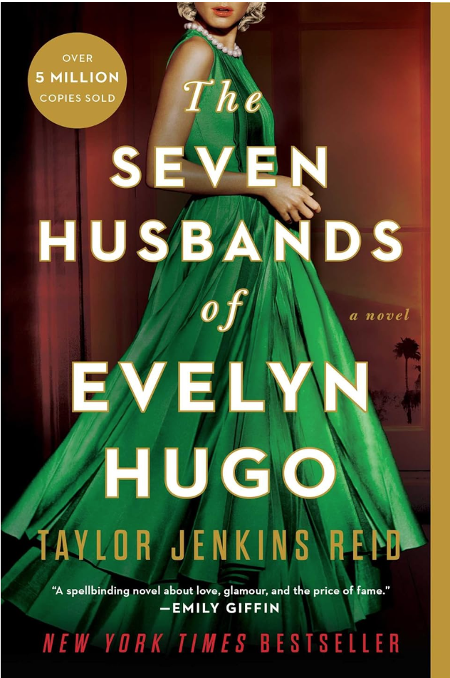 Image is of front cover of book club recommendation "The Seven Husbands of Evelyn Hugo" by Taylor Jenkins Reid. Book cover is of woman in emerald green formal dress and she is wearing a peal necklace and diamond earrings.