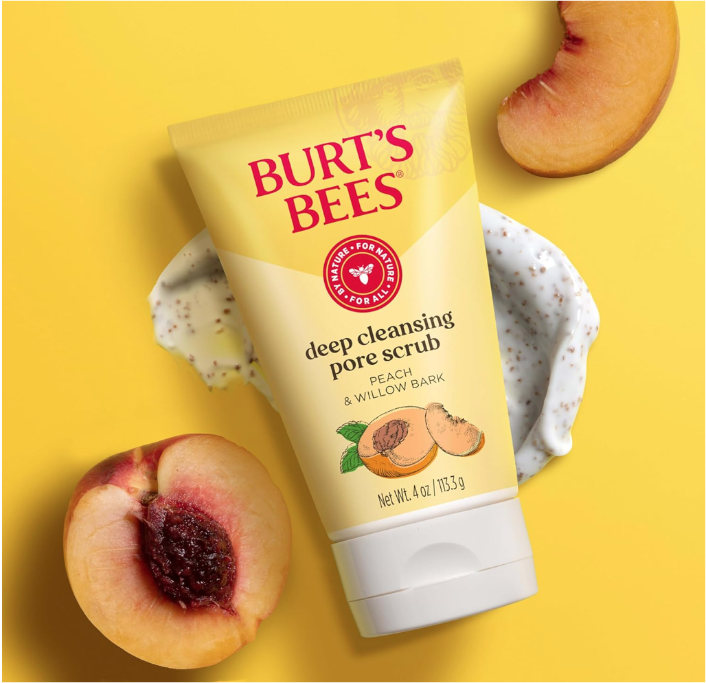 best skin care for women. Image of Burt's Bees deep cleansing pore scrub in yellow bottle with white lid and apricots in the background with yellow background.