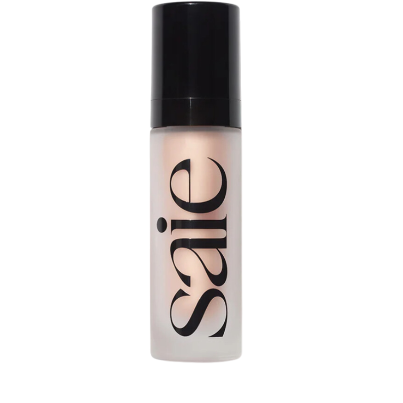 best skincare products. Image of Saie glowy super gel illuminator. Product is in a cloudy bottle with "saie" written on it and black cap. 