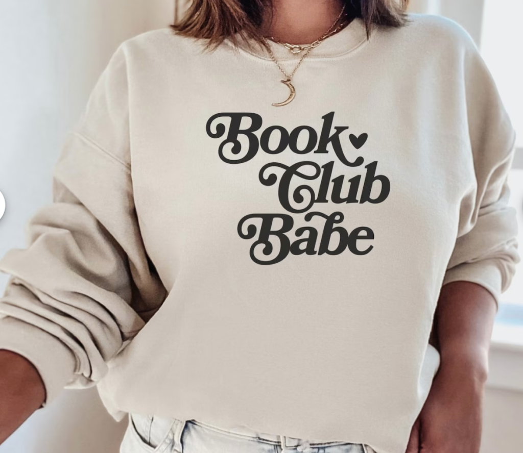 Sand color sweatshirt that says "book club babe". Link available for purchase.