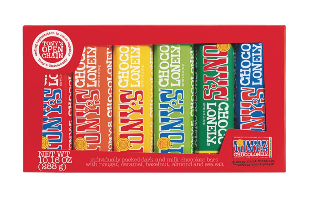 household essentials. Image of red box of Tony's chocolonely chocolates in a variety pack. Labels are red, orange, yellow, lime green, kelly green, and blue.