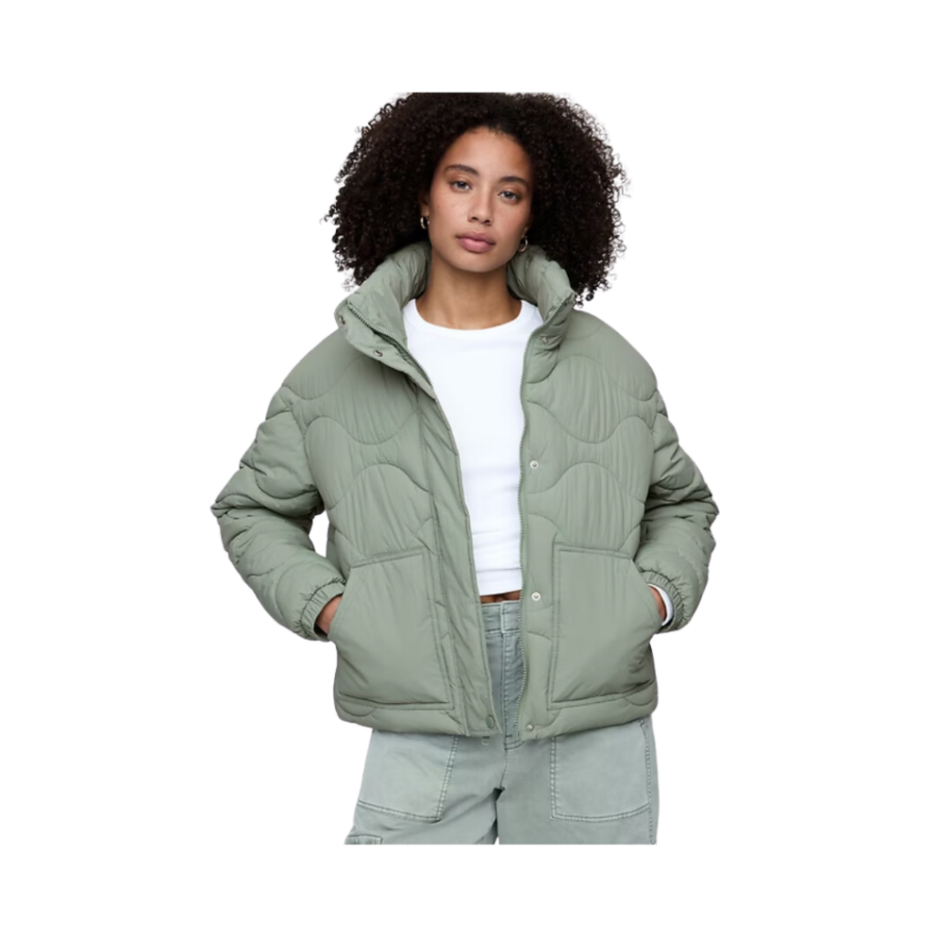 outfit ideas teachers. Woman in sage green quilted down coat with white t-shirt. 