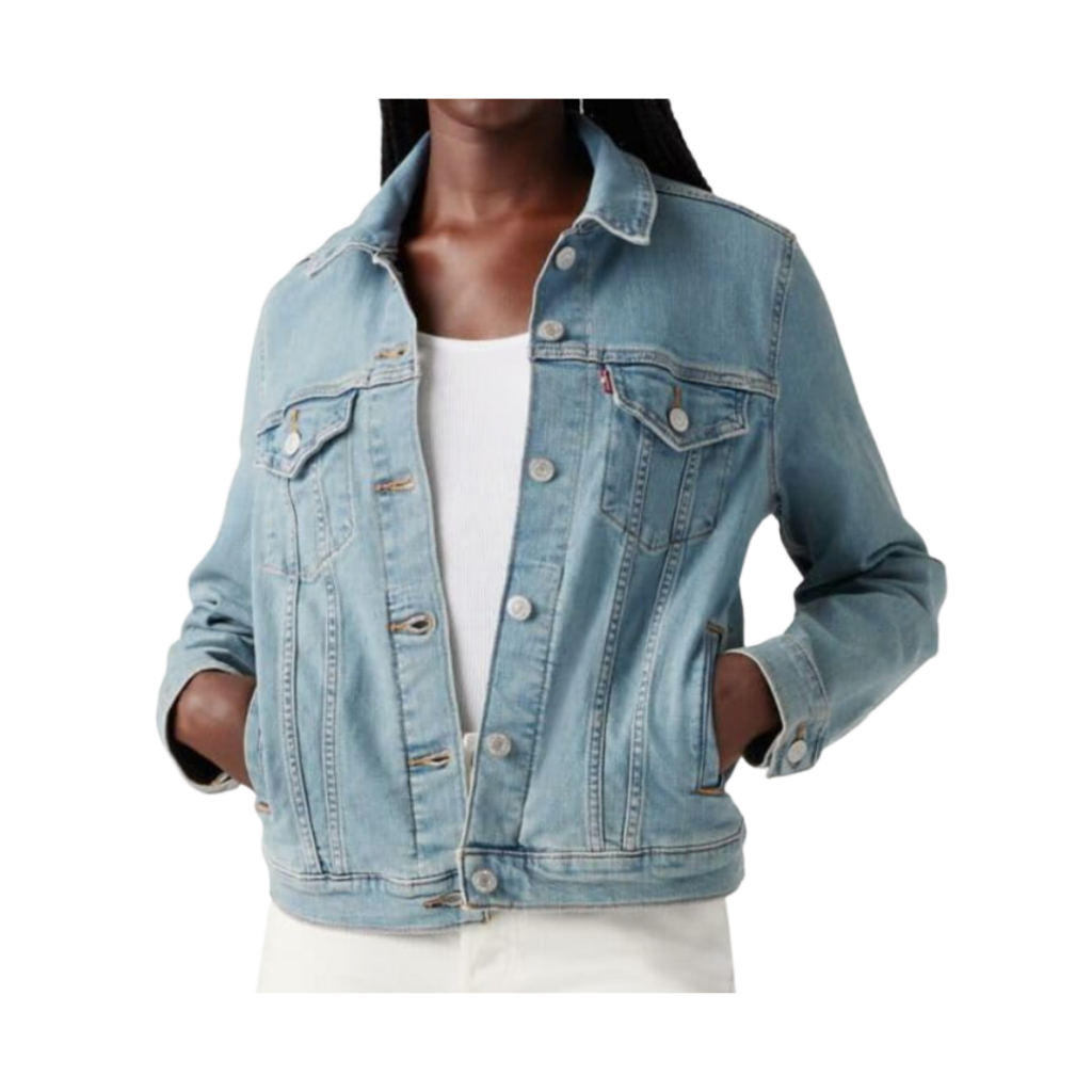 preppy teacher outfit ideas. Woman in denim coat with white shirt and hands in pockets.