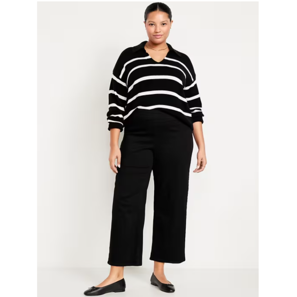 teacher jeans. Woman in black and white striped top with black cropped wide leg pants and black ballet shoes.