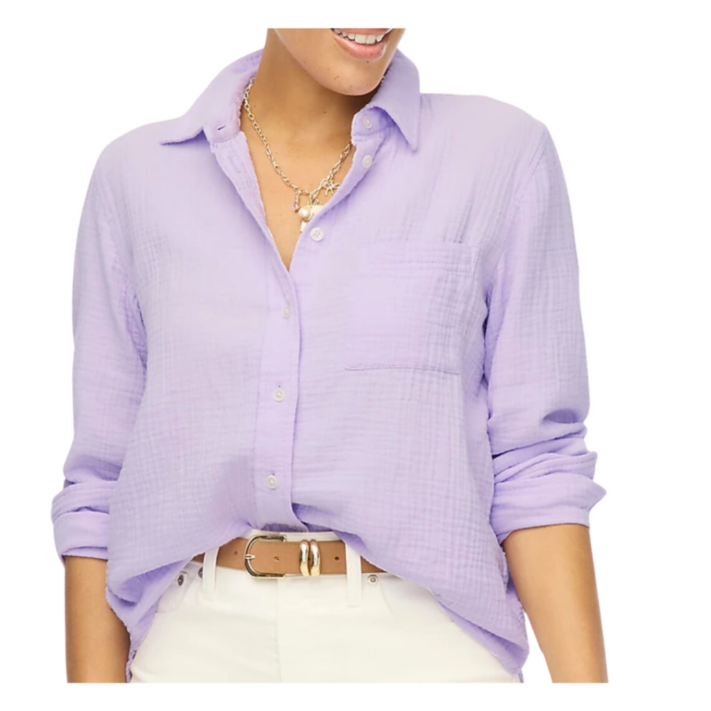 teacher outfits aesthetic. Image of woman wearing lavender gauze button up shirt with long sleeves and white pants and a leather belt.