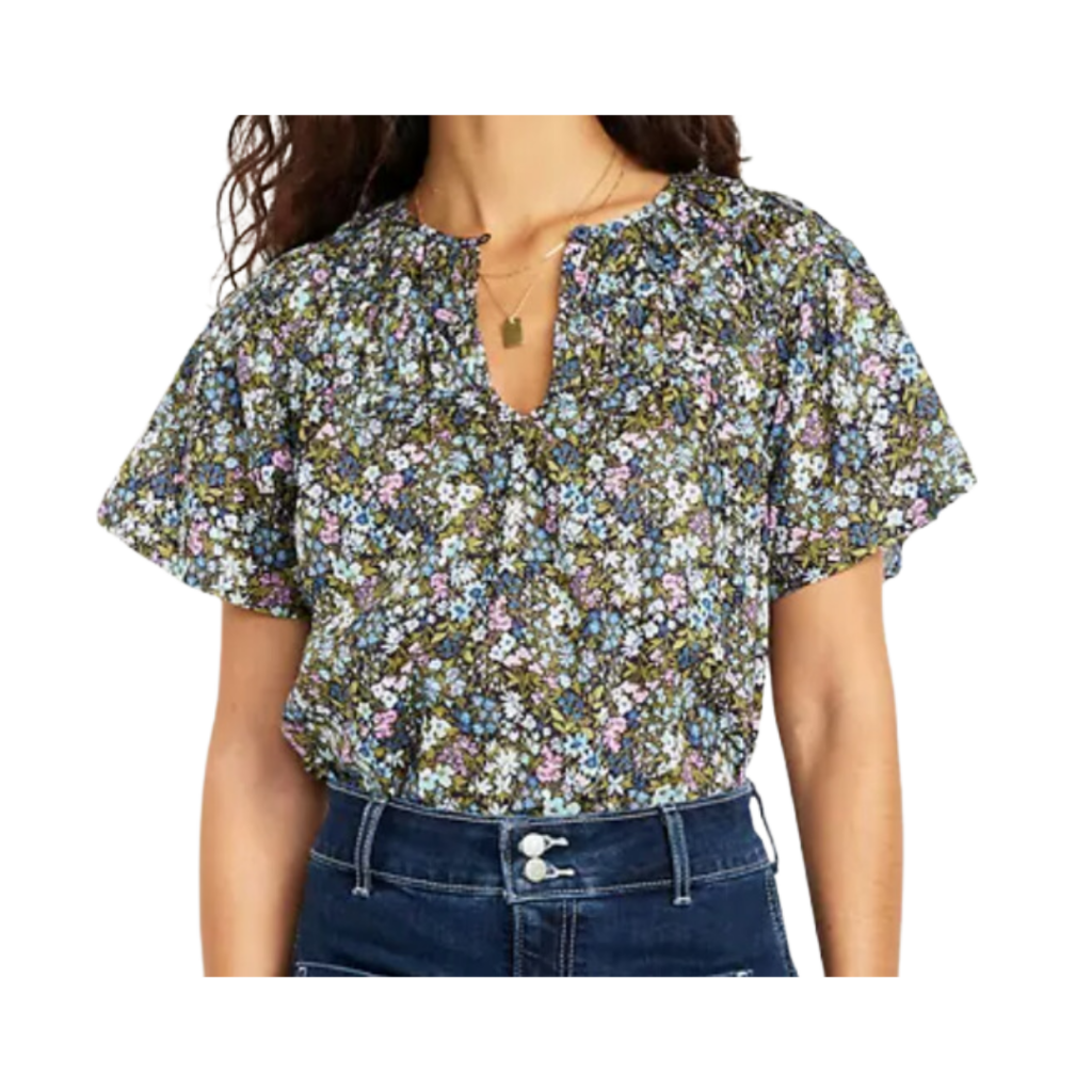 teacher outfits elementary. Image of woman wearing short sleeve floral shirt and jeans.