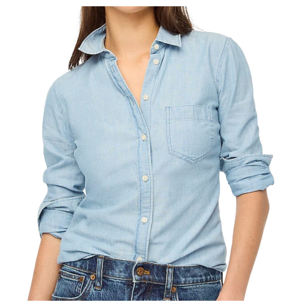 trendy teacher outfits. Image of woman wearing a denim button up long sleeve shirt and jeans.