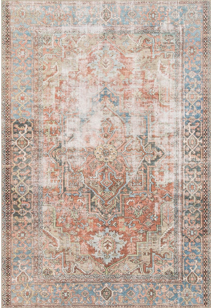 affordable rugs large. Image of rug with vintage-inspired pattern and blues, blacks, reds, pinks, and yellow colors. 