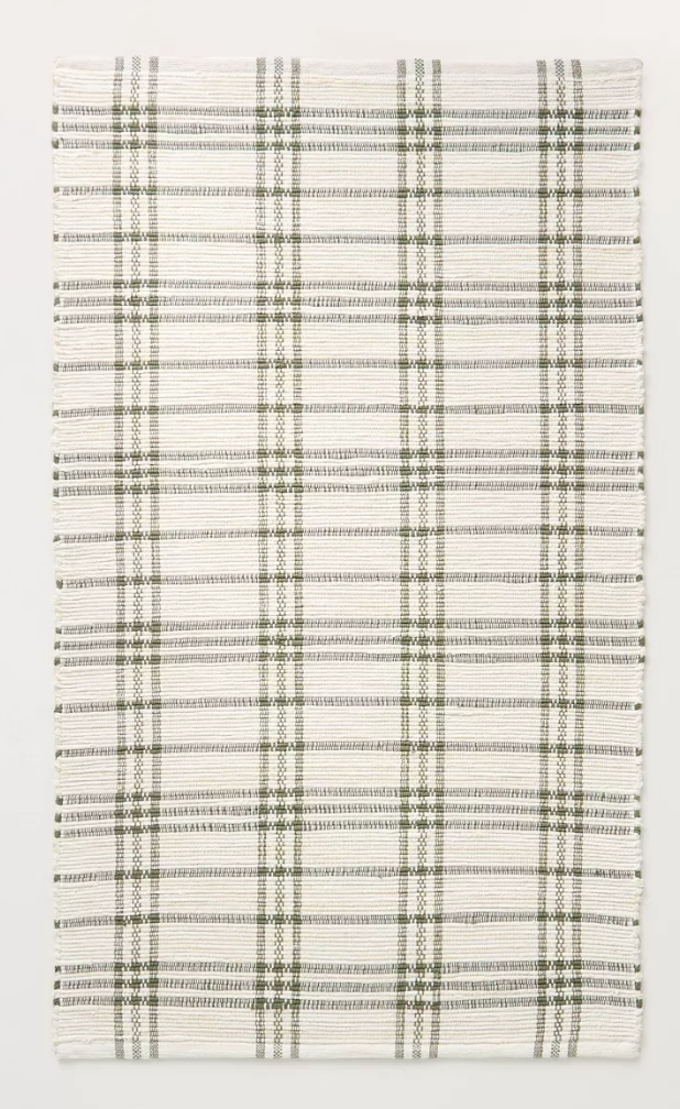 kitchen rugs. Image of cream rug with green grid pattern. 
